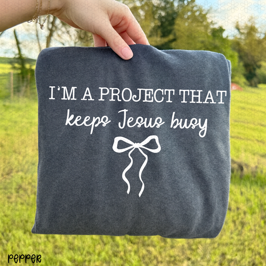 I'm A Project That Keep Jesus Busy Completed Tee