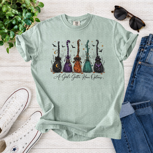 A Girls Gotta Have Options Witches Broom Completed Tee